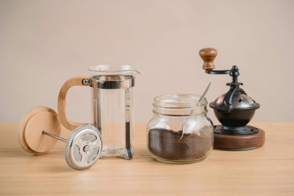 grinder, french press, and storage for coffee grounds