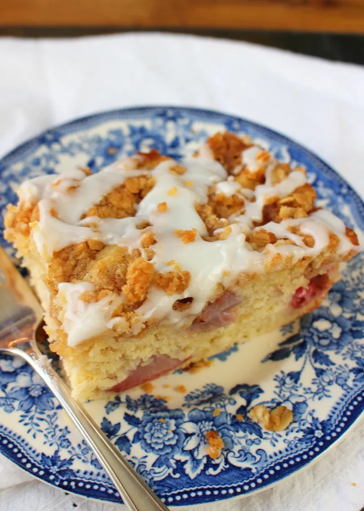 a square piece of coffee cake with strawberries inside
