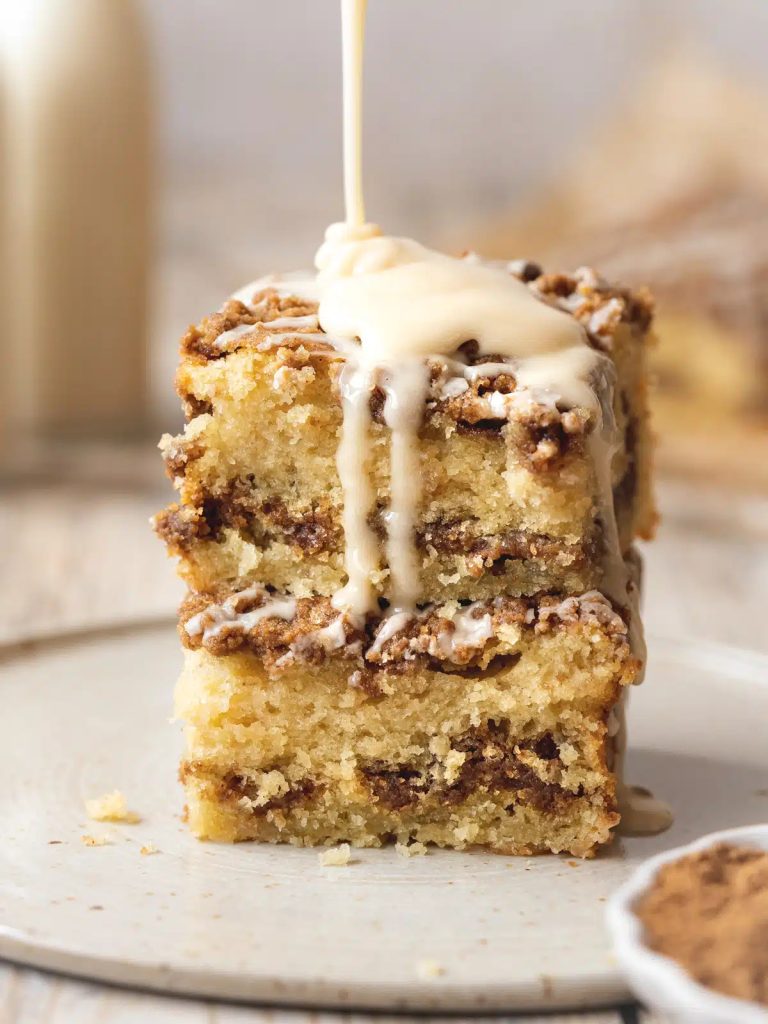cake with icing being poured on top