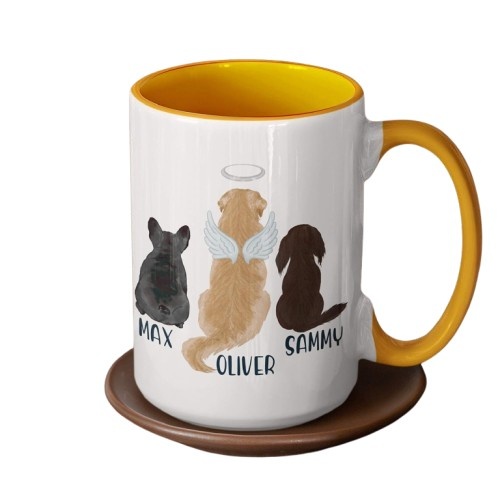 a coffee mug with dogs and yellow handle