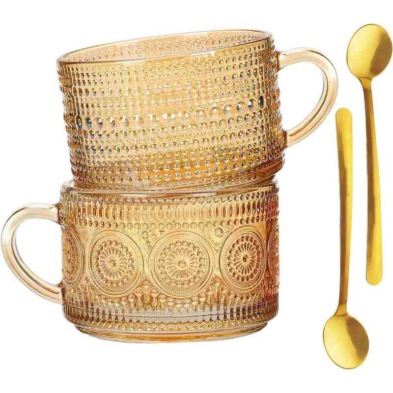 pair of glass mugs with 2 spoons