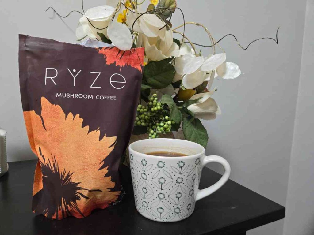ryze mushroom coffee package next to coffee mug