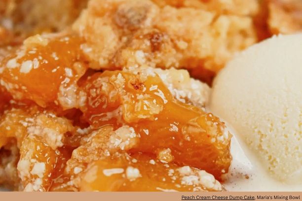 Close up of glazed peaches with a scoop of ice cream