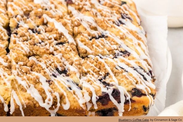 a blueberry coffee cake that was baked in a sheet pan topped with white icing