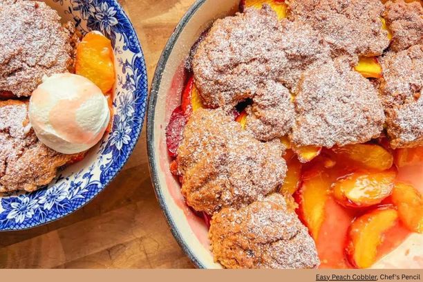 A close up of a dish of peach cobbler with a scoop of ice cream