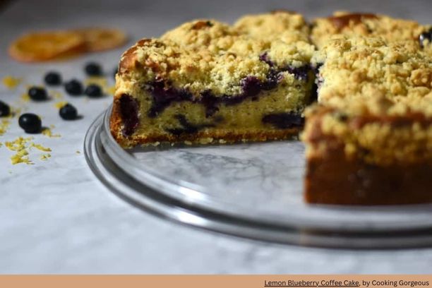 round lemon coffee cake with blueberries on a platter