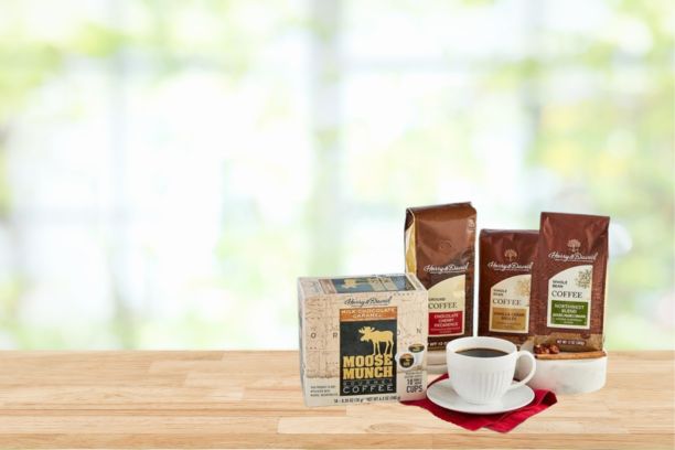 bags of moose munch coffee sitting on a kitchen counter made of wood